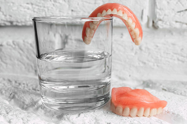 teeth in water glass