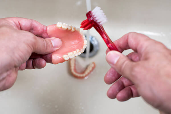 What Type of Toothbrush Should You Use to Clean Your Dentures