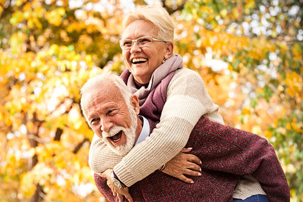 old lady on old mans back