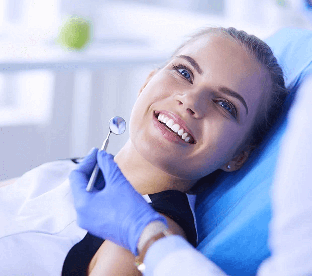 lady looking at dentist